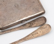 A pair of Georgian sterling silver berry spoons with engraved decoration; together with a Chinese Straits silver vintage cigarette case, early 19th and mid 20th century, (3 items), 252 grams total. - 2