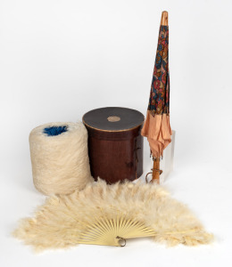 An antique feather muff in original card box, vintage feather fan, and a vintage parasol, 19th and 20th century, (3 items), the parasol 55cm long.