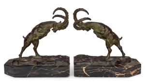 LOUIS FONTINELLE (1886-1964) pair of French Art Deco cast bronze ram bookends mounted on black marble bases, circa 1925, STAMPED "L. Fontinelle", ​​​​​​​20.5cm high.