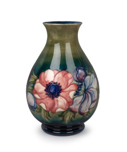 MOORCROFT "Anemone" English baluster shaped pottery vase on celadon and blue ground, impressed signature mark "Potter to H.M. The Queen, Made in England", 25cm high.