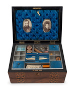 An antique English walnut sewing box lap desk with Tunbridge style banding. Interior handsomely fitted with compartments in original blue silk housing antique portrait photographs, 19th century, 17cm high, 31cm wide, 23cm deep.