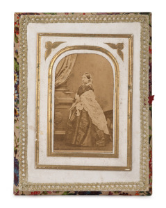 A rare ephemeral sewing box with a carte-de-visite portrait of Queen Victoria to the top, interior fitted with a complete set of ten gilt mounted card boxes each with a lithograph vignette portraits of children (originally to house needle packets), mid 19th century. A remarkable survivor. 36 x 12cm overall.