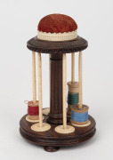 An antique rosewood, bone and ivory thread holder with pin cushion top, 19th century, 14cm high. - 2
