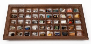 Fifty assorted thimbles in timber shadow box display, mixed vintages and origin, the box 40 x 20cm.