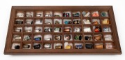 Fifty assorted thimbles in timber shadow box display, mixed vintages and origin, the box 40 x 20cm.