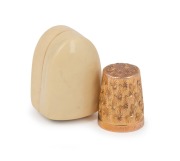 An antique 9ct gold thimble, housed in an ivorine case, 19th/20th century, 5.8 grams.