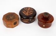 Three antique thread dispenser sewing boxes, including one example with spatter work fern decoration, 19th century, the largest 11cm diameter.