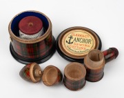 Mauchline ware red tartan thread dispenser, double ended pin cushion, egg shaped sewing kit and needle case, 19th century, (4 items), the largest 7cm high.