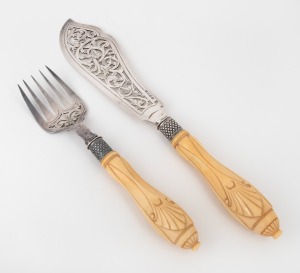 A fine quality pair of antique English sterling silver fish servers with carved ivory handles, made in Exeter, circa 1862, the knife 33cm long.