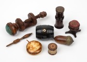 Collection of antique timber sewing accessories, including Tunbridge ware, an attractive pin cushion work clamp, " CLARK & Co. Anchor Cottons" thread dispenser, needle cases etc., 19th century, (8 items), the clamp 12cm high overall.