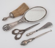 Antique sterling silver hand-mirror, scissors, shoehorn, lace hook and brush, 19th century, (5 items), the mirror 25cm long.