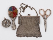 Antique sterling silver novelty pin cushion in the shape of a hand-mirror; together with a pair of sterling silver scissors, a silver plated chatelaine pin cushion and a silver plated mesh purse, 19th/20th century, (4 items), the pin cushion 10.5cm high.