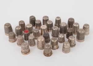 Thirty assorted antique and vintage thimbles, mostly sterling silver, 145 grams total.