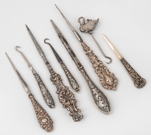 Eight assorted lace hooks and sewing implements, including an attractive swan decorated example, 19th/20th century, the swan example 6.5cm high overall.