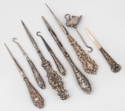 Eight assorted lace hooks and sewing implements, including an attractive swan decorated example, 19th/20th century, the swan example 6.5cm high overall.