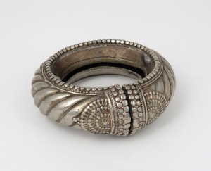 An Omani silver finished slave anklet, unknown age, ​​​​​​​13cm wide.