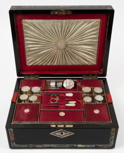 An antique sewing work box with ebonized finish and shell inlaid decoration. Interior handsomely fitted in scarlet and cream silk with compartments and an assortment of mother of pearl sewing implements, 19th century, 13cm high, 30cm wide, 23cm deep.