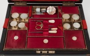 An antique sewing work box with ebonized finish and shell inlaid decoration. Interior handsomely fitted in scarlet and cream silk with compartments and an assortment of mother of pearl sewing implements, 19th century, 13cm high, 30cm wide, 23cm deep. - 2