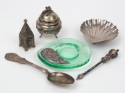 A sterling silver shell shaped dish, a Continental silver spoon, a Continental silver lidded box with rose decoration, a silver plated torah pointer (yad), a silver plated filigree spice box and a green Murano glass dish with silver mount, 19th and 20th c