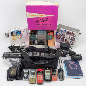 An assorted group of vintage mobile telephones, car phone, antenna, etc, also includes a vintage Bell & Howell projector, (antiques of the future)