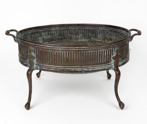 A Georgian brass tabletop jardiniere stand, 18th/19th century, ​​​​​​​26cm high, 53cm wide.