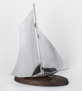 A vintage Art Deco chrome yacht ornament on timber base, 20th century, ​​​​​​​39cm high overall.
