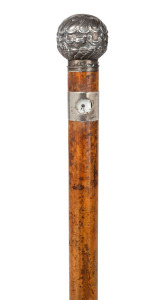 An antique Austrian novelty clock walking stick with silver cap and collar, housing a Viennese movement, stamped "L. Holuska, Wien", 19th century, ​​​​​​​87cm high.