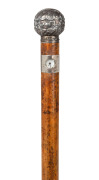 An antique Austrian novelty clock walking stick with silver cap and collar, housing a Viennese movement, stamped "L. Holuska, Wien", 19th century, ​​​​​​​87cm high.