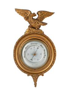 A vintage English wall mounted aneroid compensated barometer in attractive gilt surround with eagle crest, early 20th century, 45cm high.