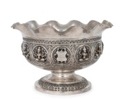 An antique Indian silver bowl with repousse decoration, most likely Madras region, late 19th century, 14cm high, 21cm wide, 395 grams.