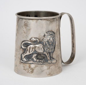 An Ethiopian 835 silver tankard with repousse lion decoration, 20th century, 10cm high, 262 grams.