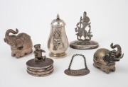 An antique sterling silver "Whiskey" decanter label, a 925 sterling silver Teddy bear pill box, a Siamese silver placename holder (weighted base), a Thai 925 silver pepper pot, a Laotian silver elephant box and a silver plated elephant box, 19th/20th cent