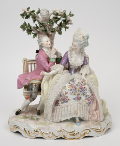 An antique Continental porcelain figural group with lace decoration, 19th century, blue cross swords mark to base, ​​​​​​​30cm high.
