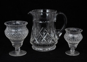 Two antique English cut crystal monteiths, together with a vintage crystal water jug, 19th and 20th century, the jug 18cm high.