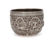 An antique Burmese silver bowl with repousse animal decoration, 19th/20th century, ​​​​​​​10cm high, 13cm wide, 332 grams.