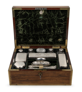 A fine quality antique English brass bound kingwood dressing table box fitted with original sterling silver topped crystal bottles and an assortment of sterling silver accessories, original plush green velvet interior with original Bramah lock and key, early 19th century, embossed maker's label "Edwards, Manufacturer To His Majesty, 21 King St. Bloomsbury, London, 13.5cm high, 32cm wide, 24cm deep.