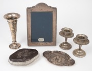 A vintage sterling silver picture frame, a sterling silver trumpet vase with repousse iris decoration (weighted base), a pair of Continental silver candle holders (weighted bases), "Chorus of Angels" sterling silver dish and lidded crystal box, 19th/20th 