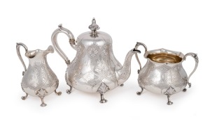 An antique English three piece sterling silver tea service with engraved decoration in the Aesthetic style, by Richard Hodd & William Linley, made in London, circa 1862, the largest 19cm high, 1324 grams total.