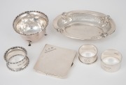 Sterling silver pierced dish, cigarette case, sugar bowl and three napkin rings, 19th/20th century, (6 items), 288 grams total.