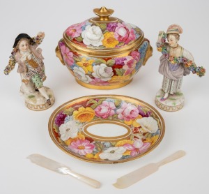 A pair of antique Continental porcelain statuettes with flower garlands; together with a pair of mother of pearl pate knives and an antique English lidded sugar basin and dish, attractively painted with all over floral motif, 19th century, (5 items), A/F,
