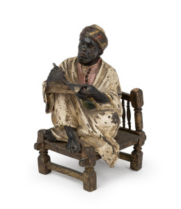An antique Austrian cold-painted bronze statue of a seated scholar, circa 1900, ​​​​​​​11cm high.