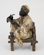 An antique Austrian cold-painted bronze statue of a seated scholar, circa 1900, ​​​​​​​11cm high. - 2