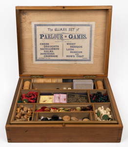 "THE CLIMAX SET OF PARLOUR GAMES" antique gaming box with assorted gaming pieces (of mixed origins), attractively displayed in original timber case with lithograph labels inside and out, mostly 19th century. 13cm high, 46cm wide, 35cm deep.