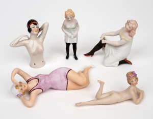 Five assorted antique and vintage porcelain cosey and piano dolls, ​​​​​​​the largest 15cm long.
