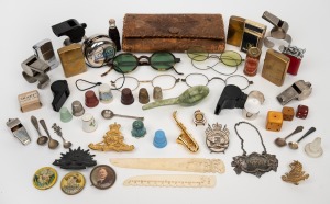 Vintage cigarette lighters, thimbles, referee whistles, ornaments, spectacles, military badges etc., mixed vintages, (qty).