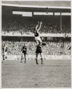 A collection of original photographs, including a very rare example of later AFL CEO Ross Oakley in St Kilda uniform titled 'SCHOOLBOYS CLINIC, HOBART 23rd August, 1964', together with other examples of action photographs featuring Oakley. (Approx. 30 pho - 2