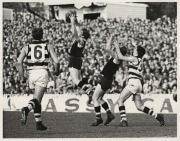 A collection of original photographs, including a very rare example of later AFL CEO Ross Oakley in St Kilda uniform titled 'SCHOOLBOYS CLINIC, HOBART 23rd August, 1964', together with other examples of action photographs featuring Oakley. (Approx. 30 pho - 3