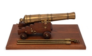 Miniature cast bronze working model cannon on timber stand with accessories, 20th century, ​​​​​​​the barrel 28cm long