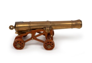 Miniature cast bronze working model cannon on timber carriage with timber wheels, 20th century, the barrel 39cm long