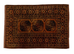 A hand-knotted tribal rug in copper tone Note: Fringe reduced in several places. 198 x 133cm.